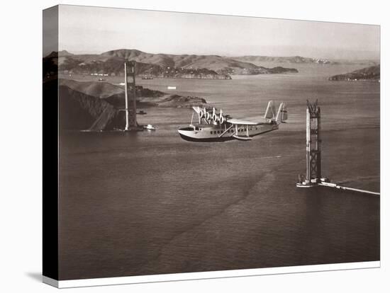 Sikorsky S-42 through the Golden Gate under Construction, San Francisco, 1935-Clyde Sunderland-Stretched Canvas