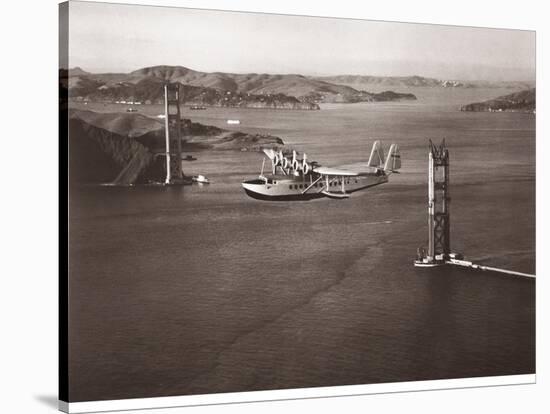 Sikorsky S-42 through the Golden Gate under Construction, San Francisco, 1935-Clyde Sunderland-Stretched Canvas