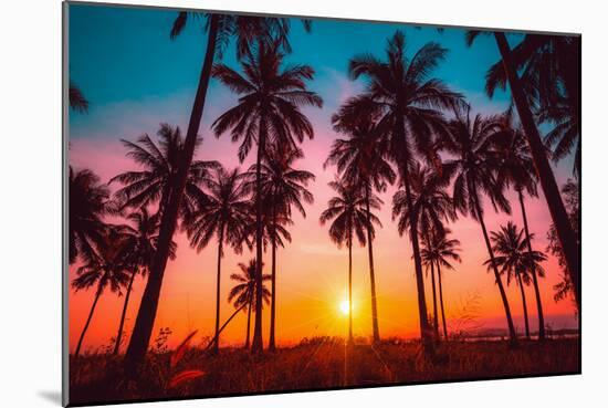 Silhouette Coconut Palm Trees on Beach at Sunset. Vintage Tone.-Nuttawut Uttamaharad-Mounted Photographic Print