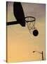 Silhouette of a Basketball Going Through a Basketball Net-null-Stretched Canvas