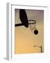 Silhouette of a Basketball Going Through a Basketball Net-null-Framed Premium Photographic Print