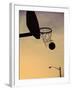 Silhouette of a Basketball Going Through a Basketball Net-null-Framed Premium Photographic Print