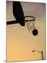 Silhouette of a Basketball Going Through a Basketball Net-null-Mounted Premium Photographic Print