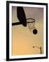 Silhouette of a Basketball Going Through a Basketball Net-null-Framed Photographic Print