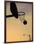 Silhouette of a Basketball Going Through a Basketball Net-null-Framed Photographic Print