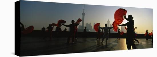 Silhouette of a Group of People Dancing in Front of Pudong, the Bund, Shanghai, China-null-Stretched Canvas