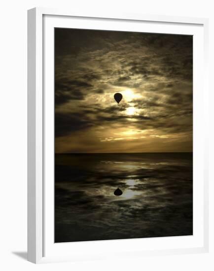 Silhouette of a Hot Air Balloon Over Water-null-Framed Premium Photographic Print