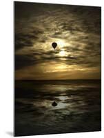 Silhouette of a Hot Air Balloon Over Water-null-Mounted Premium Photographic Print