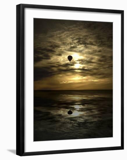 Silhouette of a Hot Air Balloon Over Water-null-Framed Photographic Print