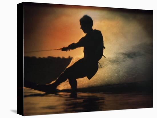 Silhouette of a Man Water Skiing-null-Stretched Canvas