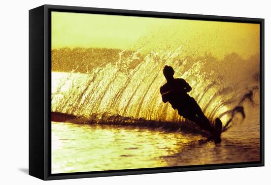 Silhouette of a man waterskiing in sea-null-Framed Stretched Canvas