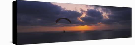 Silhouette of a Person Paragliding over the Sea, Blacks Beach, San Diego, California, USA-null-Stretched Canvas