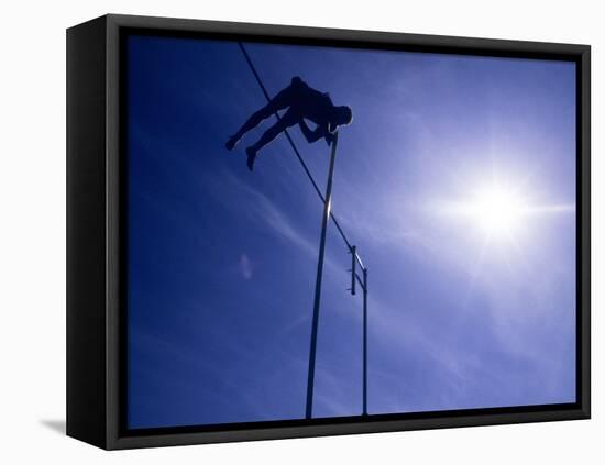 Silhouette of a Pole Vaulter in Action-null-Framed Stretched Canvas