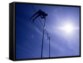 Silhouette of a Pole Vaulter in Action-null-Framed Stretched Canvas