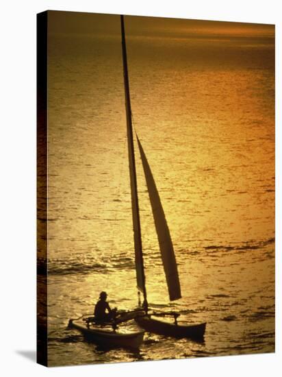 Silhouette of a Sailboat in the Sea-null-Stretched Canvas