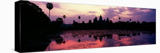 Silhouette of a Temple at Dusk, Angkor Wat, Siem Reap, Angkor, Cambodia-null-Stretched Canvas