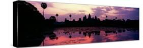 Silhouette of a Temple at Dusk, Angkor Wat, Siem Reap, Angkor, Cambodia-null-Stretched Canvas