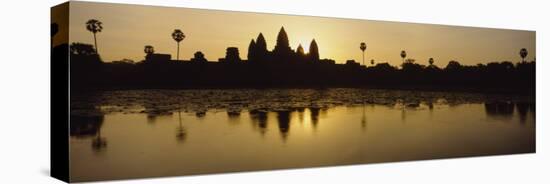 Silhouette of a Temple at Sunrise, Angkor Wat, Cambodia-null-Stretched Canvas