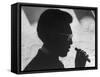 Silhouette of Actor/Comedian Bill Cosby with Cigar, Former Star of TV Series "I Spy"-John Loengard-Framed Stretched Canvas