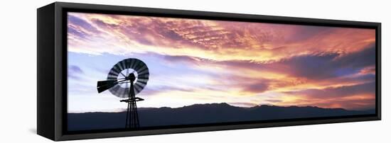 Silhouette of an American-style windmill at sunset, near Salton City, California, USA-Panoramic Images-Framed Stretched Canvas