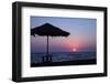 Silhouette of an excited man jumping on black sand beach early morning sunrise in Santorini, Greece-Michele Niles-Framed Photographic Print