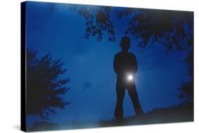 Silhouette of Boy Holding Flashlight-William P. Gottlieb-Stretched Canvas