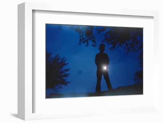 Silhouette of Boy Holding Flashlight-William P. Gottlieb-Framed Photographic Print