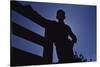 Silhouette of Boy Leaning Against Fence-William P. Gottlieb-Stretched Canvas
