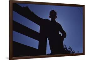 Silhouette of Boy Leaning Against Fence-William P. Gottlieb-Framed Photographic Print