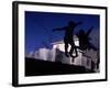 Silhouette of Children Bouncing on a Trampoline-Bill Eppridge-Framed Photographic Print