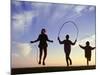 Silhouette of Children Jumping Rope Outdoors-Mitch Diamond-Mounted Photographic Print