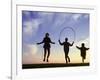 Silhouette of Children Jumping Rope Outdoors-Mitch Diamond-Framed Photographic Print