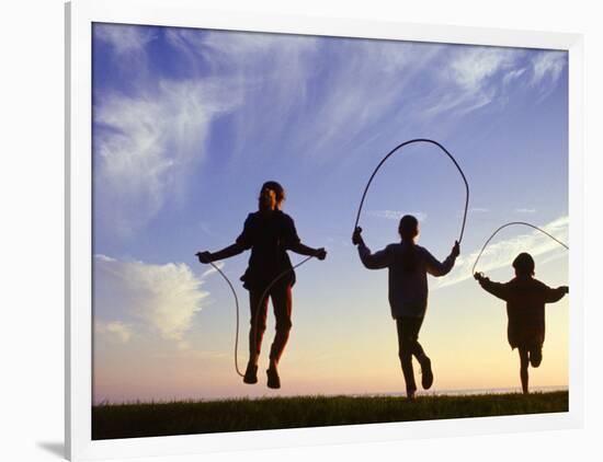 Silhouette of Children Jumping Rope Outdoors-Mitch Diamond-Framed Photographic Print