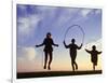 Silhouette of Children Jumping Rope Outdoors-Mitch Diamond-Framed Photographic Print