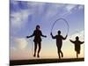 Silhouette of Children Jumping Rope Outdoors-Mitch Diamond-Mounted Photographic Print