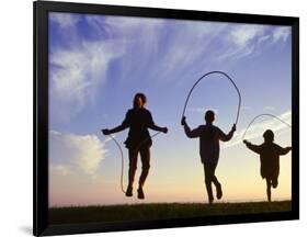 Silhouette of Children Jumping Rope Outdoors-Mitch Diamond-Framed Photographic Print