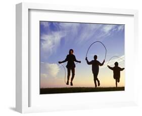 Silhouette of Children Jumping Rope Outdoors-Mitch Diamond-Framed Photographic Print