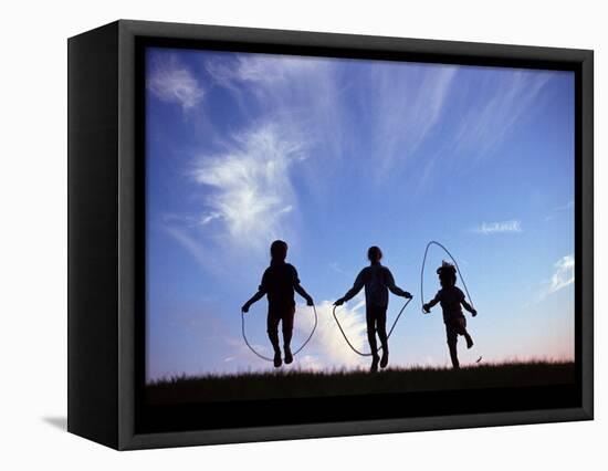 Silhouette of Children Playing Outdoors-Mitch Diamond-Framed Stretched Canvas