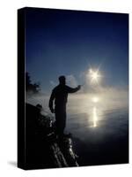 Silhouette of Fisherman Casting a Line into Lake, Ontario, Canada-Mark Carlson-Stretched Canvas