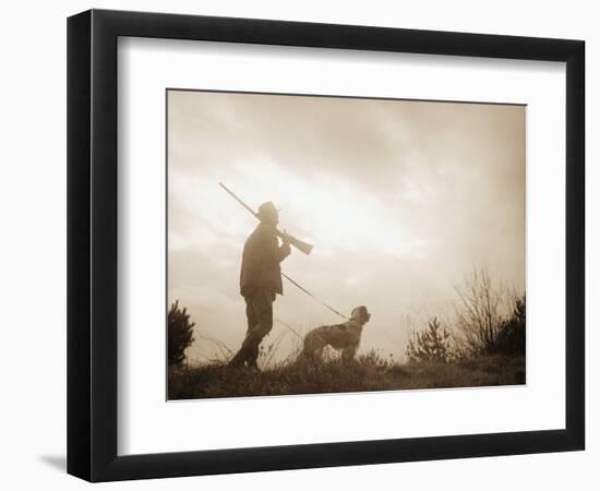 Silhouette of Hunter with Bird Dog under Clouds-Philip Gendreau-Framed Photographic Print