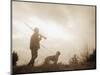Silhouette of Hunter with Bird Dog under Clouds-Philip Gendreau-Mounted Photographic Print