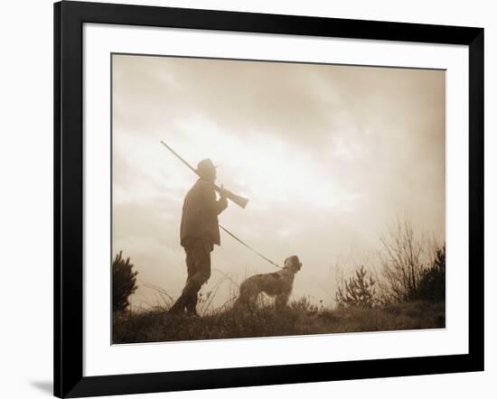 Silhouette of Hunter with Bird Dog under Clouds-Philip Gendreau-Framed Photographic Print