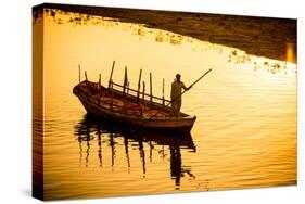 Silhouette of Indian Gondolier During the Flower Holi Festival, Vrindavan, Uttar Pradesh-Laura Grier-Stretched Canvas