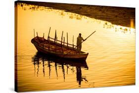 Silhouette of Indian Gondolier During the Flower Holi Festival, Vrindavan, Uttar Pradesh-Laura Grier-Stretched Canvas