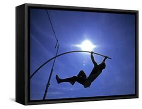 Silhouette of Male Pole Vaulter-Steven Sutton-Framed Stretched Canvas