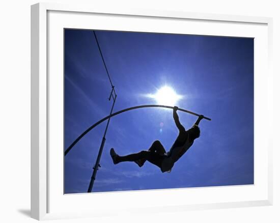 Silhouette of Male Pole Vaulter-Steven Sutton-Framed Photographic Print