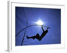 Silhouette of Male Pole Vaulter-Steven Sutton-Framed Photographic Print