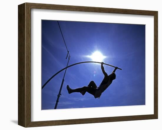 Silhouette of Male Pole Vaulter-Steven Sutton-Framed Photographic Print