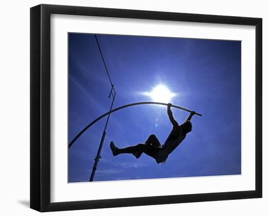 Silhouette of Male Pole Vaulter-Steven Sutton-Framed Photographic Print