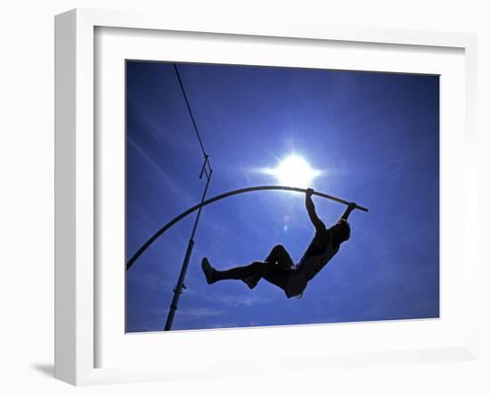 Silhouette of Male Pole Vaulter-Steven Sutton-Framed Photographic Print